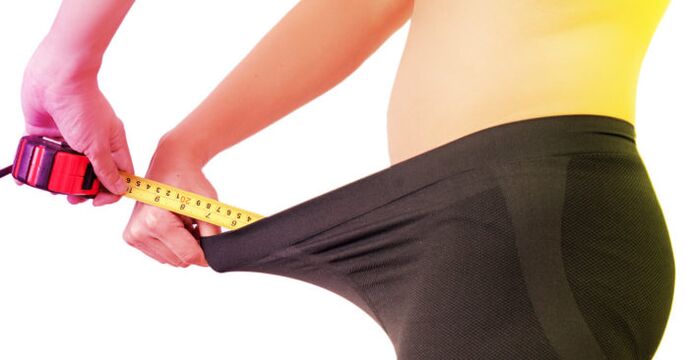 a man measures his penis before he enlarges it